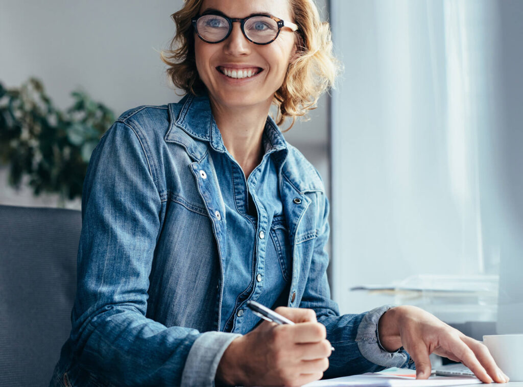 woman signing papers