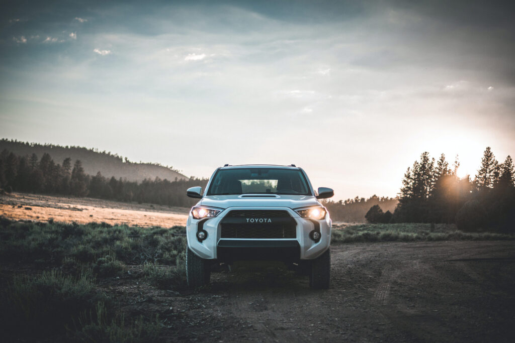 white SUV in field