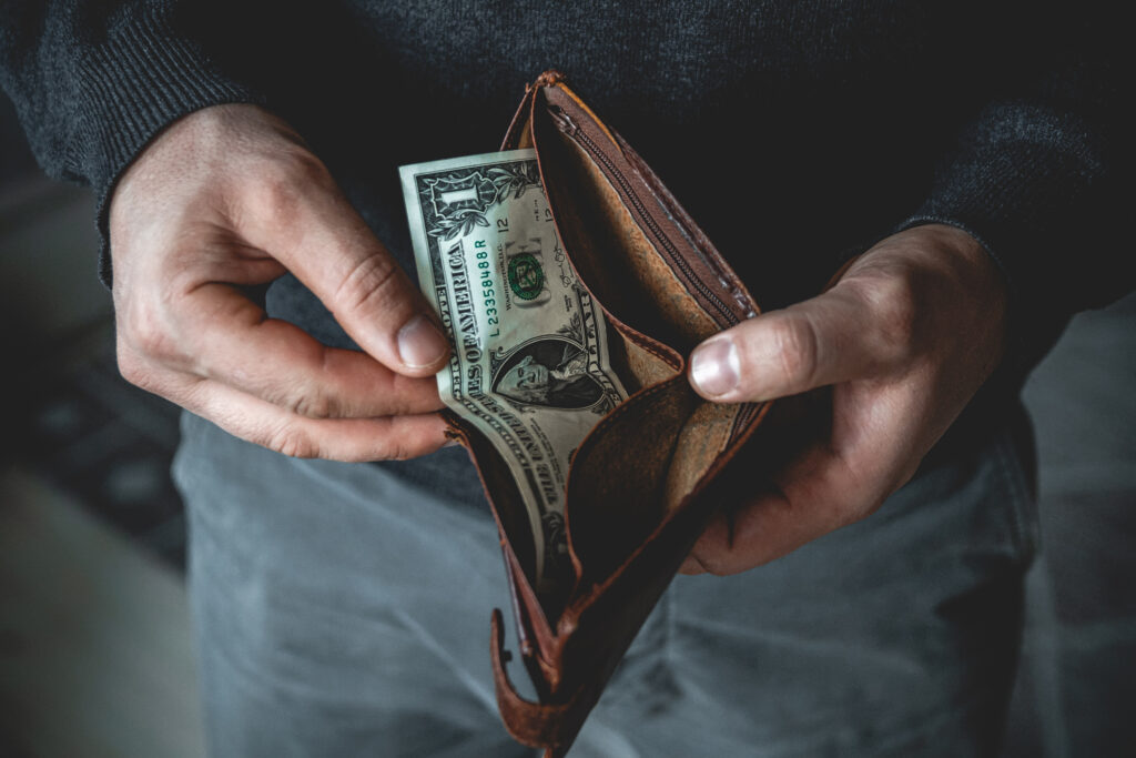 Man holding wallet with cash