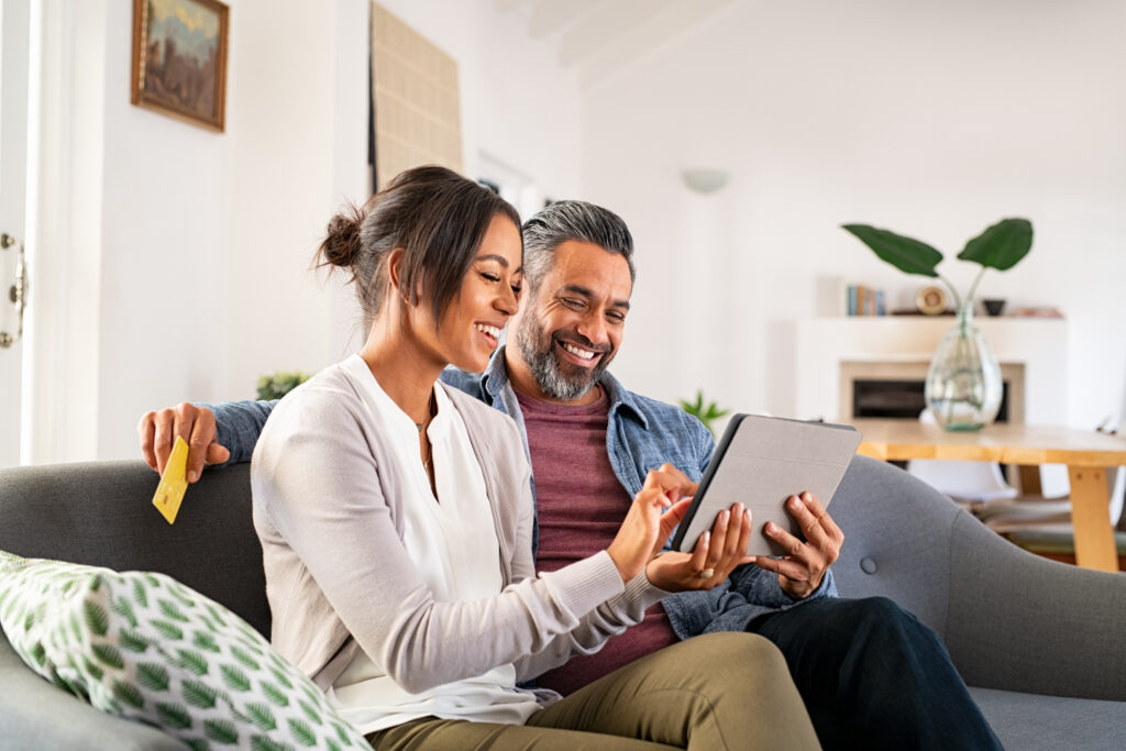 Man and woman looking and an iPad