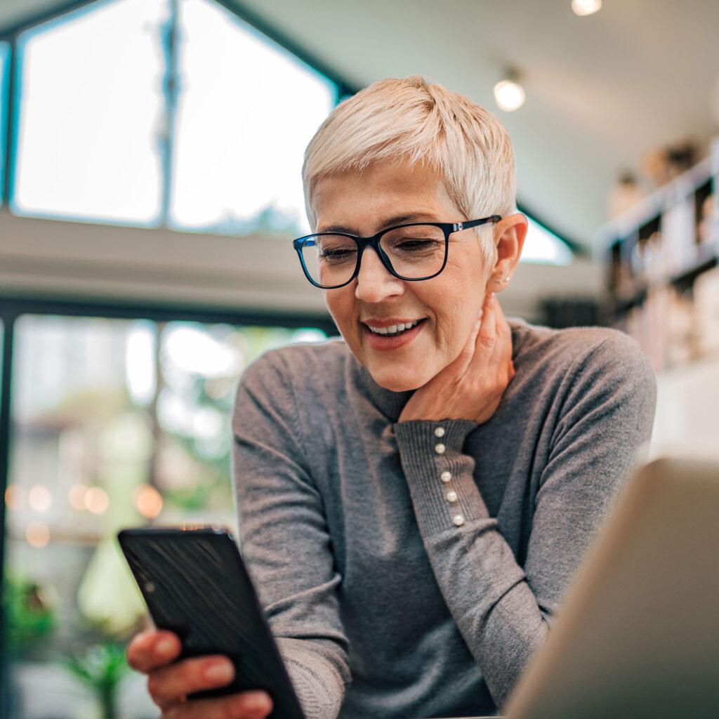 woman discovers new information on her phone to protect her against cyber crime